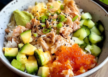 Canned tuna rice bowl with fresh ingredients and toppings