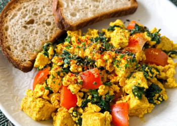 Delicious tofu scramble served on a plate with vegetables