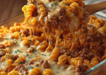 Cheesy Hamburger Casserole dish served with a side salad