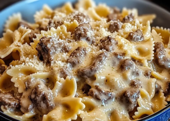 Creamy parmesan garlic beef bowtie pasta served in a bowl