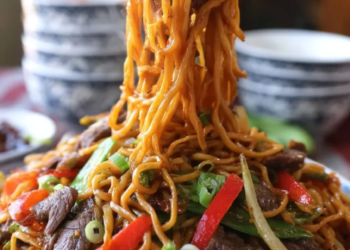 Plate of easy beef lo mein with vegetables and egg noodles