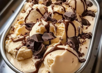 A bowl of homemade Moose Tracks Ice Cream with chocolate and peanut butter swirls