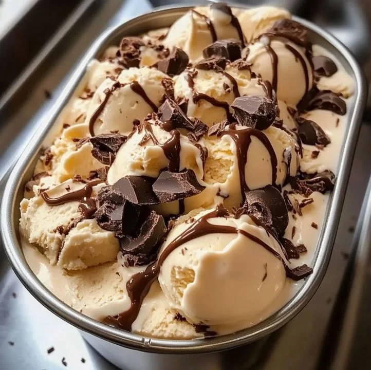 A bowl of homemade Moose Tracks Ice Cream with chocolate and peanut butter swirls