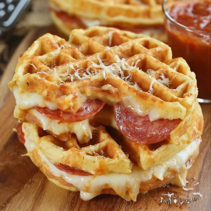 Delicious pizza stuffed waffles served on a plate